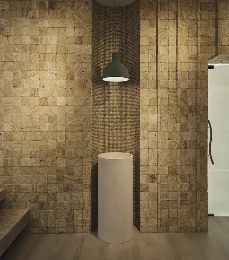 freestanding sink with stone wall