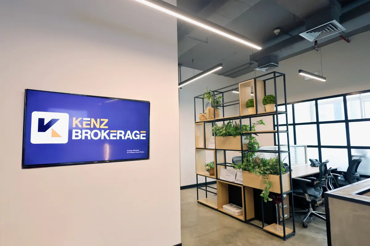 Kenz Brokerage logo office reception wall