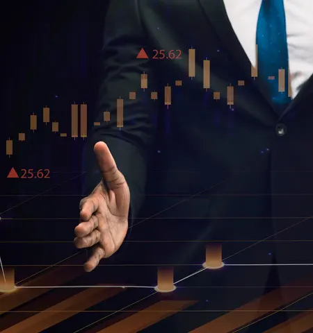 Businessman analyzing candlestick trading charts