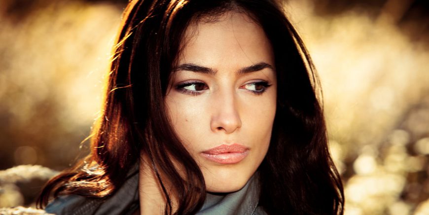 Young brunette woman  portrait in autumn field