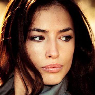 Young brunette woman  portrait in autumn field